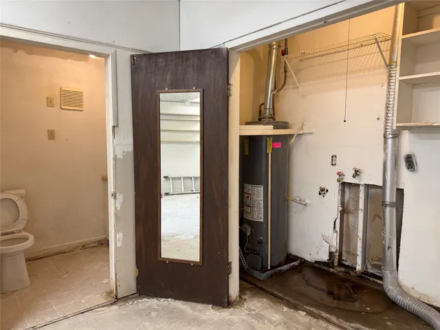 a view of a livingroom with a staircase and a ceiling fan