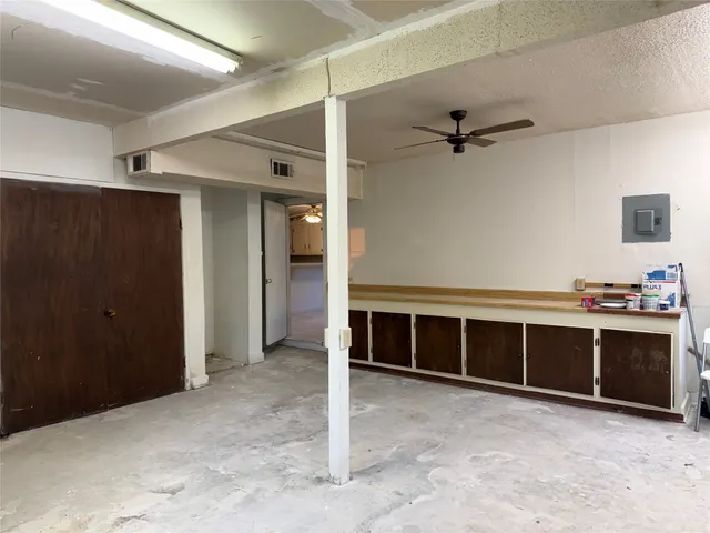 a view of a livingroom with furniture and staircase