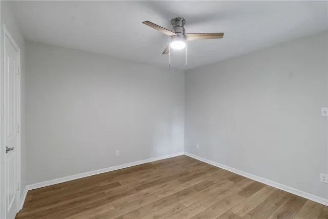 a kitchen with granite countertop a sink stainless steel appliances and cabinets