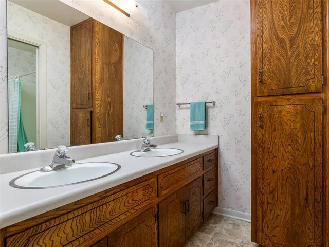 a bathroom with a sink and a mirror