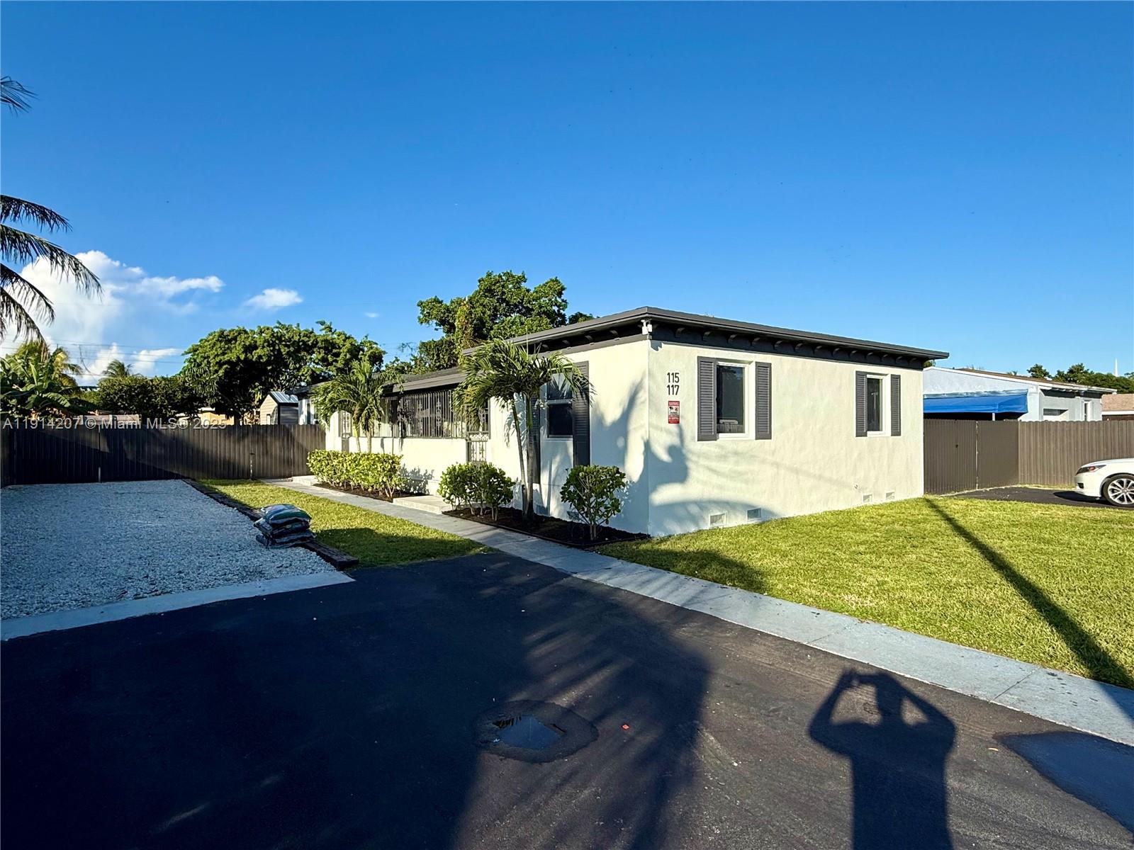 a view of a house with backyard porch and sitting area