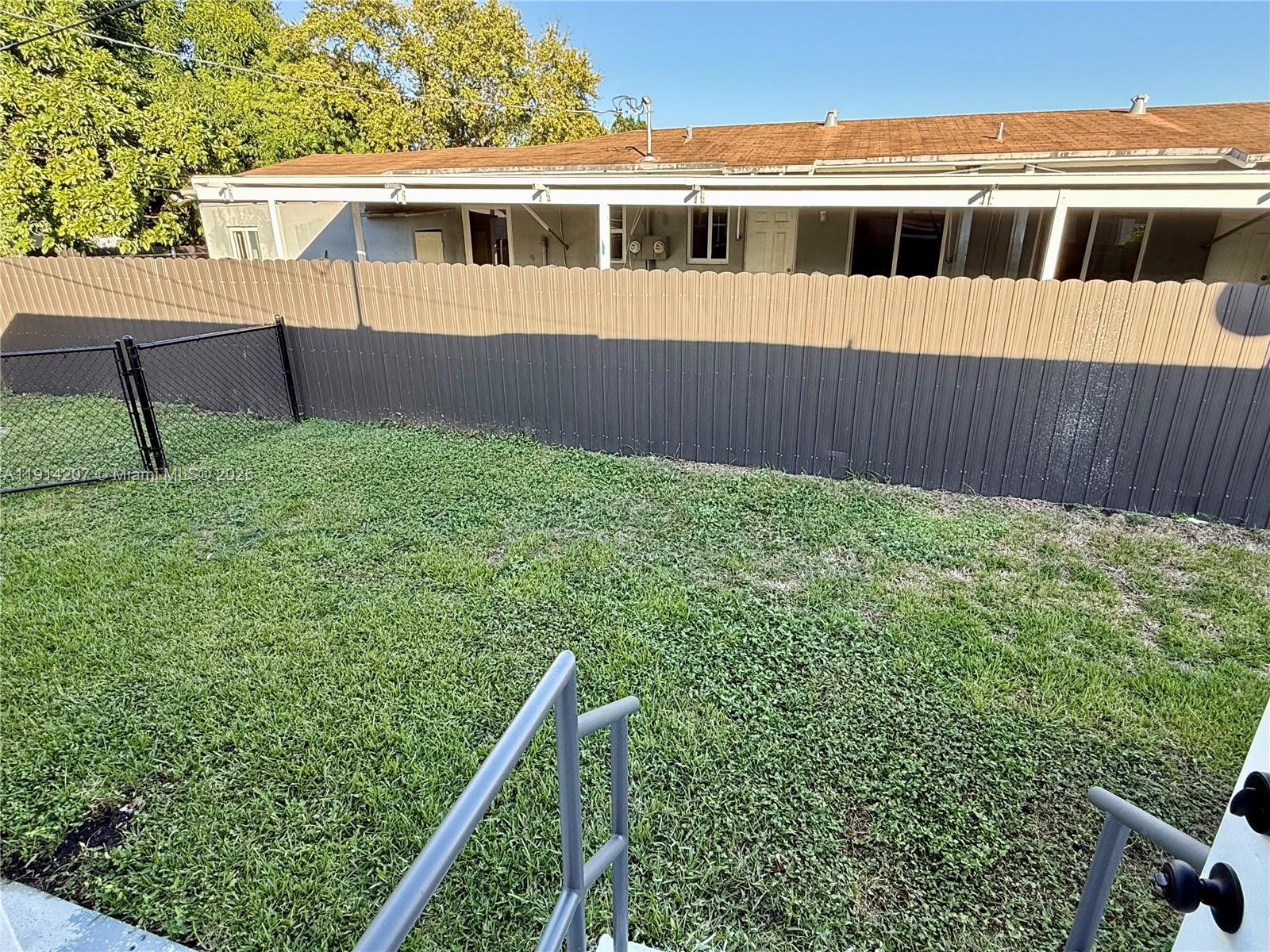 117 Northwest 118th Street, Unit 117 Miami, FL 33168 - Photo 20 of 20 a view of a house with a deck
