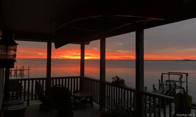 a view of a garage with cars