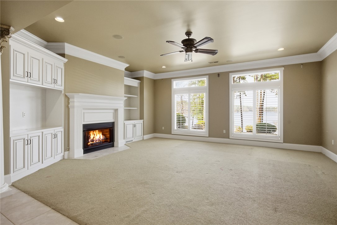 610 Highridge Drive Seneca, SC 29672 - Photo 38 of 50 This inviting lower level room features a fireplace and scenic views, perfect for relaxation and everyday living.