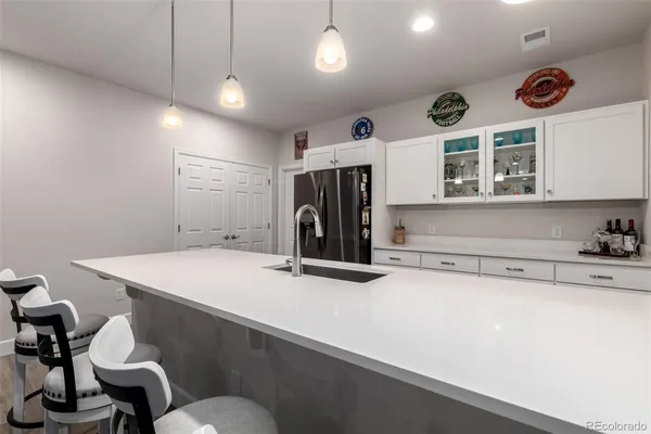 a kitchen with a stove and a refrigerator