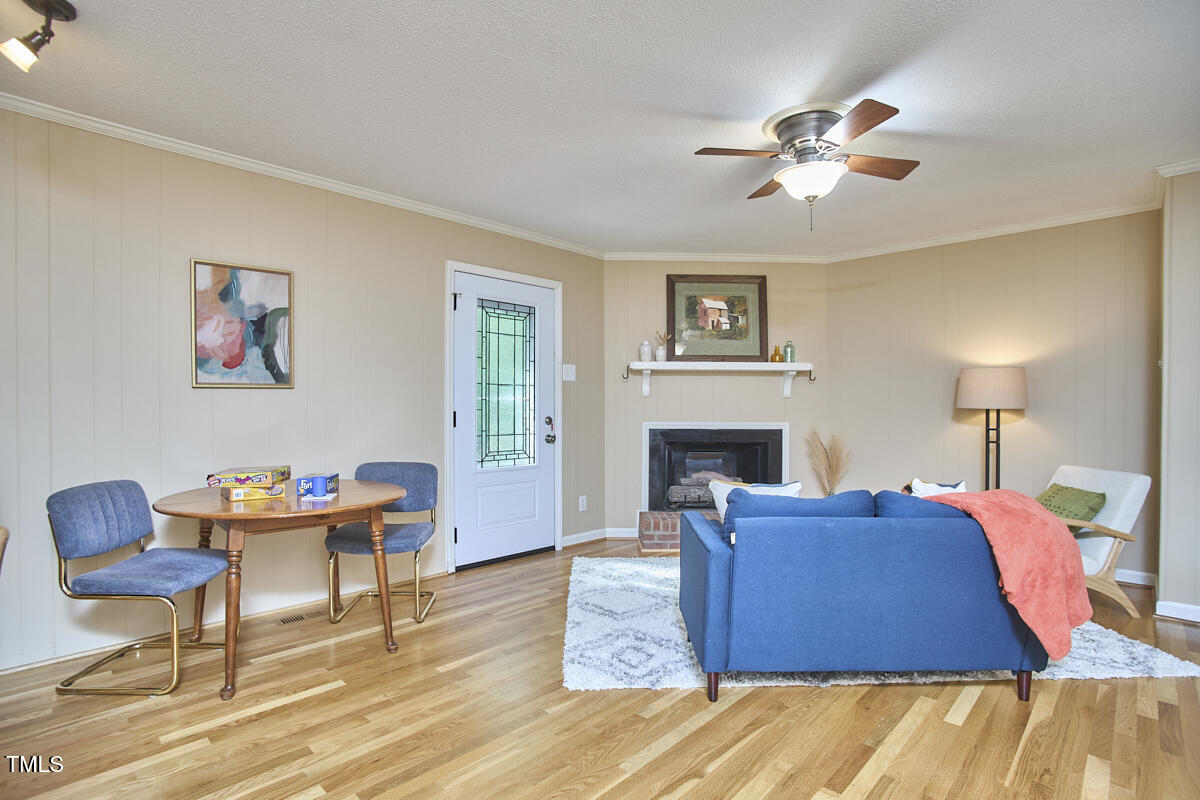 5319 Memory Lane Durham, NC 27712 - Photo 13 of 29 a bedroom with a bed and wooden floor