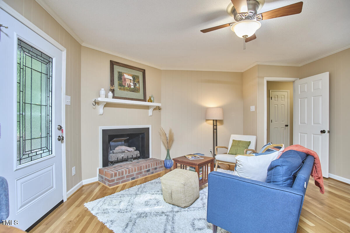 5319 Memory Lane Durham, NC 27712 - Photo 15 of 29 a living room with furniture and a fireplace