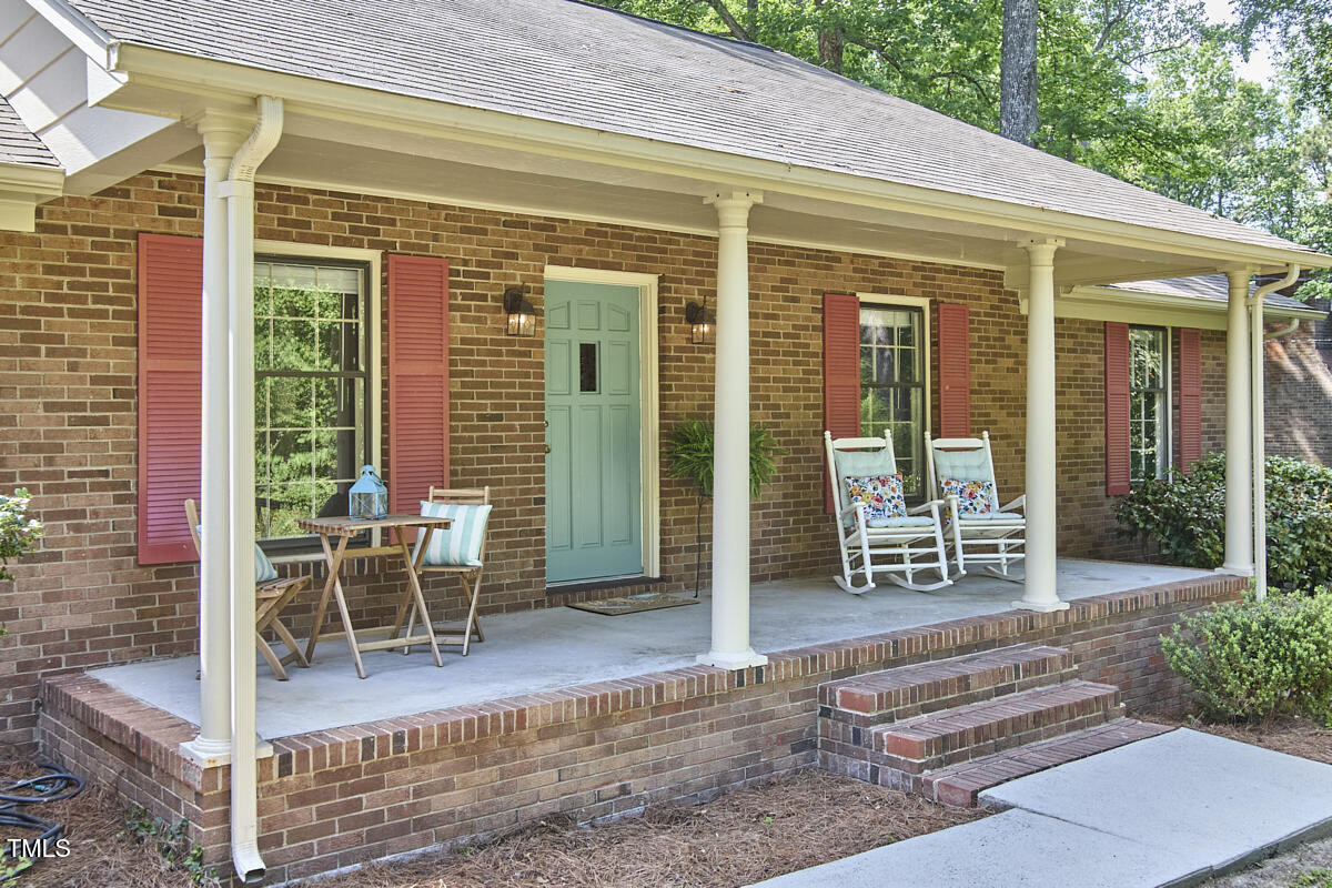 5319 Memory Lane Durham, NC 27712 - Photo 2 of 29 a view of a patio with table and chairs and potted plants