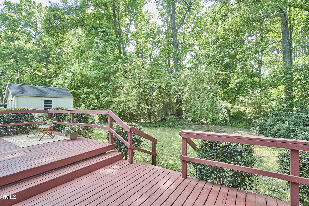 5319 Memory Lane Durham, NC 27712 - Photo 23 of 29 a view of a balcony with wooden floor and fence