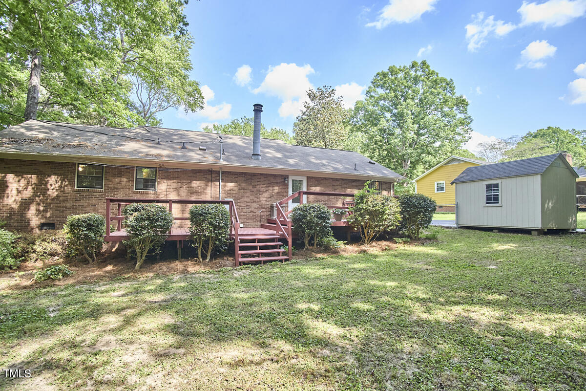 5319 Memory Lane Durham, NC 27712 - Photo 24 of 29 a front view of house with a garden