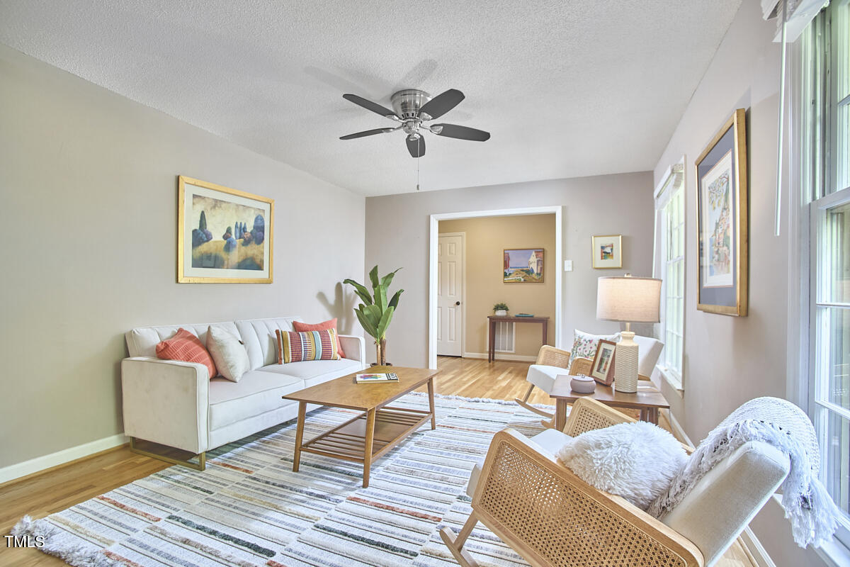5319 Memory Lane Durham, NC 27712 - Photo 6 of 29 a living room with furniture and a wooden floor