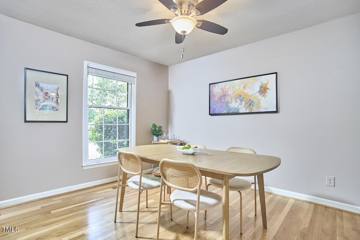 5319 Memory Lane Durham, NC 27712 - Photo 8 of 29 a view of a dining room with furniture and a chandelier