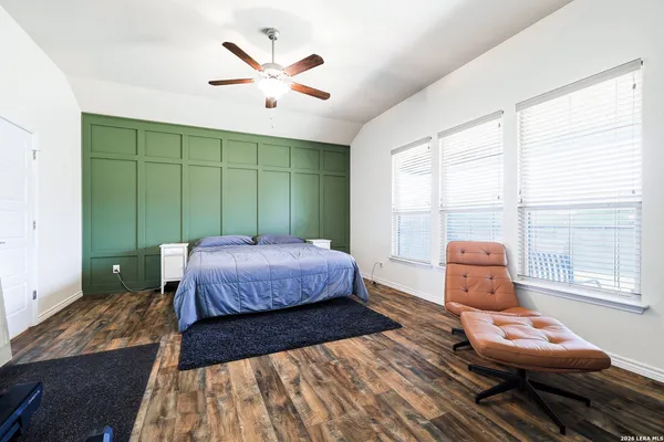 a bedroom with a bed and window