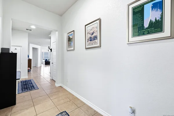 a view of a hallway with a living room