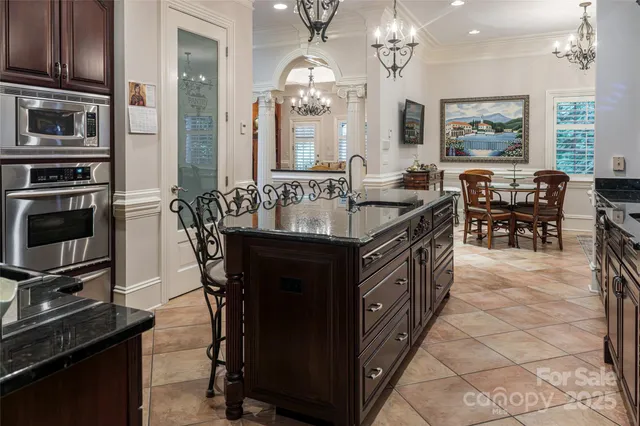 a large kitchen with kitchen island a large island in the center