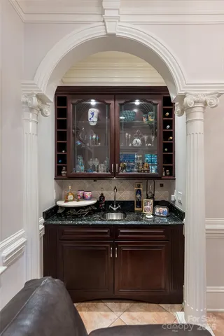 a kitchen with a sink and cabinets