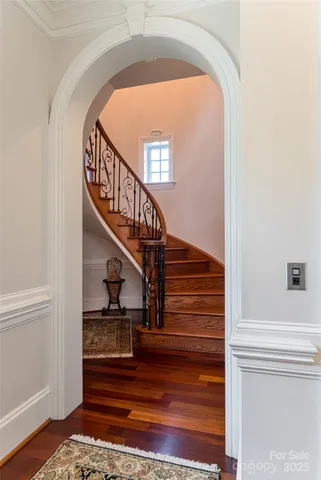 a view of entryway and hall with wooden floor