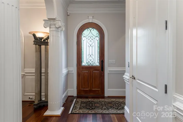 a view of entryway with wooden floor