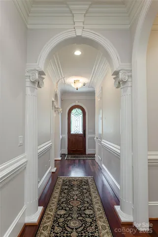 a view of a hallway with a chandelier