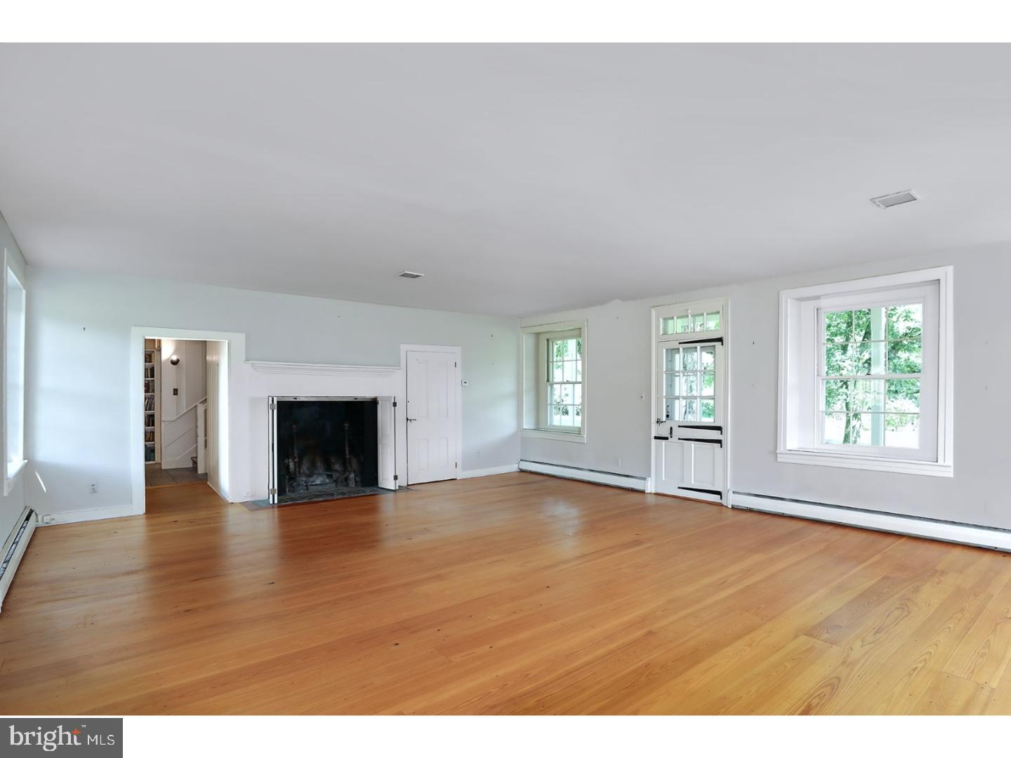 180 Municipal Road Pipersville, PA 18947 - Photo 12 of 60 a view of empty room with wooden floor and fireplace