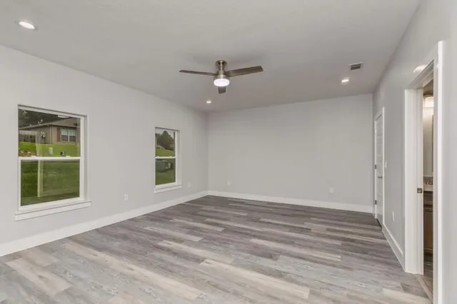 a view of an empty room with a window