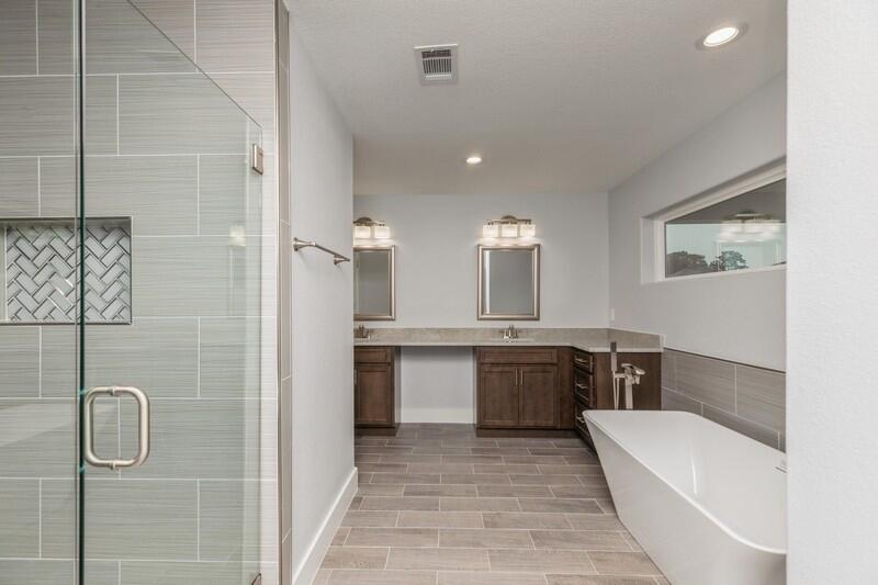 4516 Hermosa Road Crestview, FL 32539 - Photo 26 of 35 a large bathroom with a tub sink shower and mirror