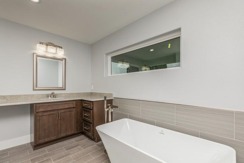 4516 Hermosa Road Crestview, FL 32539 - Photo 27 of 35 a bathroom with a tub sink and mirror