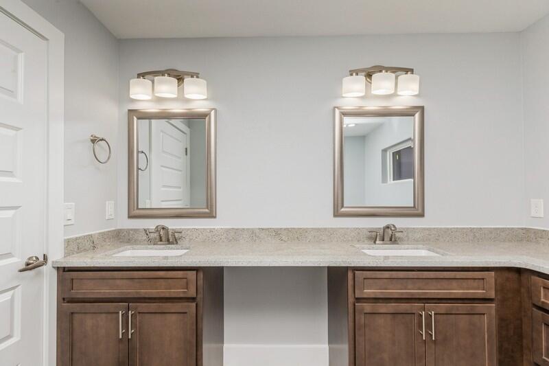 4516 Hermosa Road Crestview, FL 32539 - Photo 28 of 35 a bathroom with a sink a vanity and a mirror