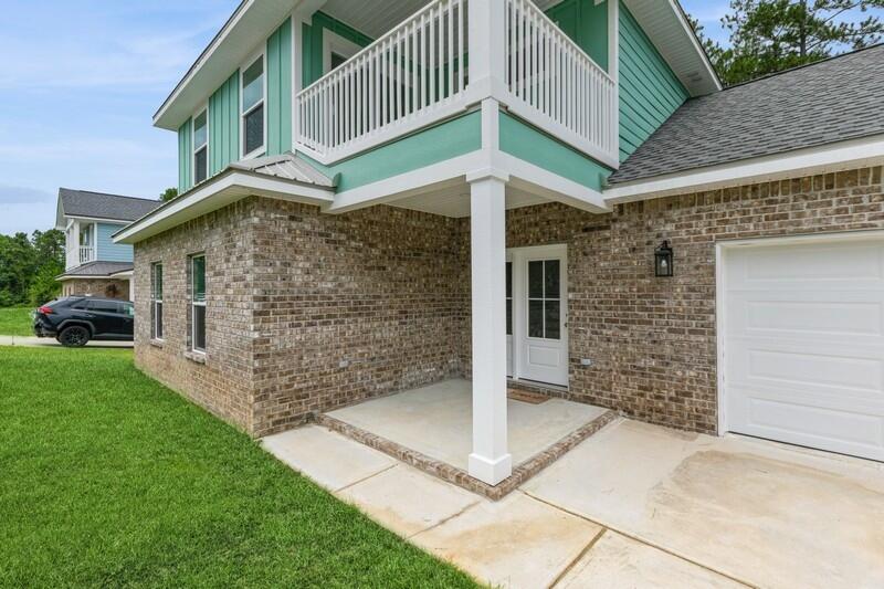 4516 Hermosa Road Crestview, FL 32539 - Photo 3 of 35 a front view of a house with a yard