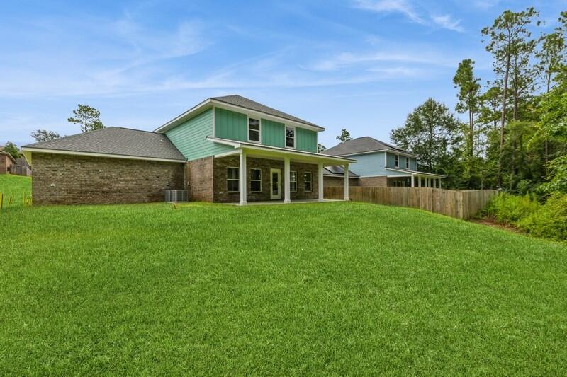 4516 Hermosa Road Crestview, FL 32539 - Photo 34 of 35 a front view of a house with a yard