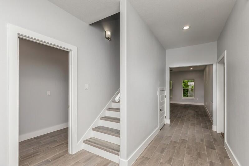 4516 Hermosa Road Crestview, FL 32539 - Photo 4 of 35 a view of a hallway with wooden floor and entryway