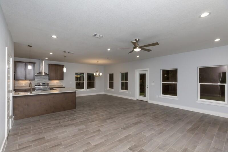 4516 Hermosa Road Crestview, FL 32539 - Photo 6 of 35 a view of a kitchen with a sink and a stove top oven