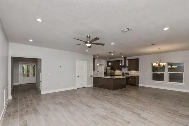 a view of a living room and kitchen