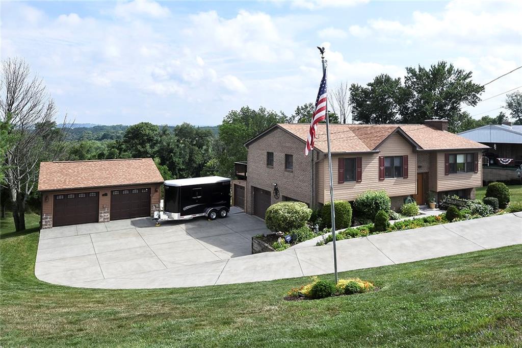 201 County Line Road Bridgeville, PA 15017 - Photo 3 of 25 Large driveway with a 2 car integral garage and a 2 car detached garage!