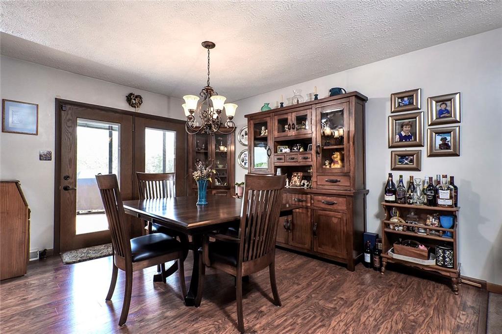 201 County Line Road Bridgeville, PA 15017 - Photo 9 of 25 Dining area has hardwood floors and glass doors leading to the back patio.
