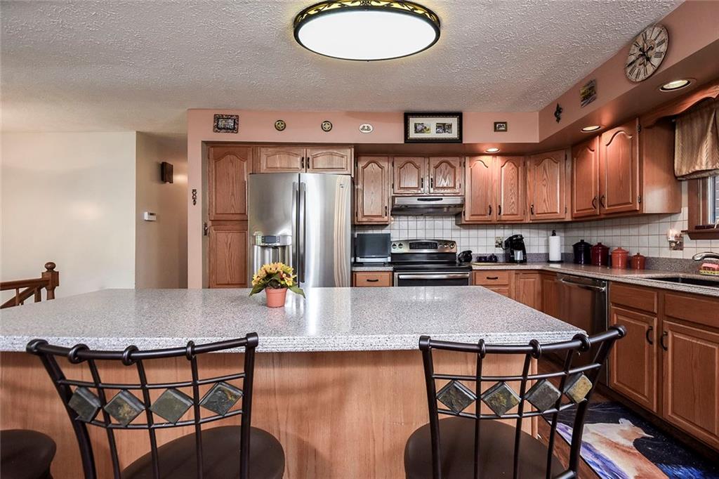 201 County Line Road Bridgeville, PA 15017 - Photo 10 of 25 Beautiful kitchen with spacious center island and lots of cabinetry for storage.