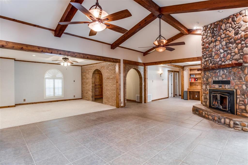 9470 S Highway Pilot Point, TX 76258 - Photo 4 of 26 a view of a livingroom with an empty space and a fireplace