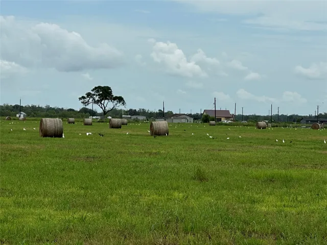 a view of a golf course with chairs