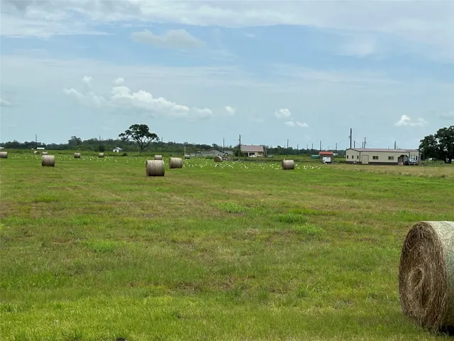 a view of a lake with houses in the back