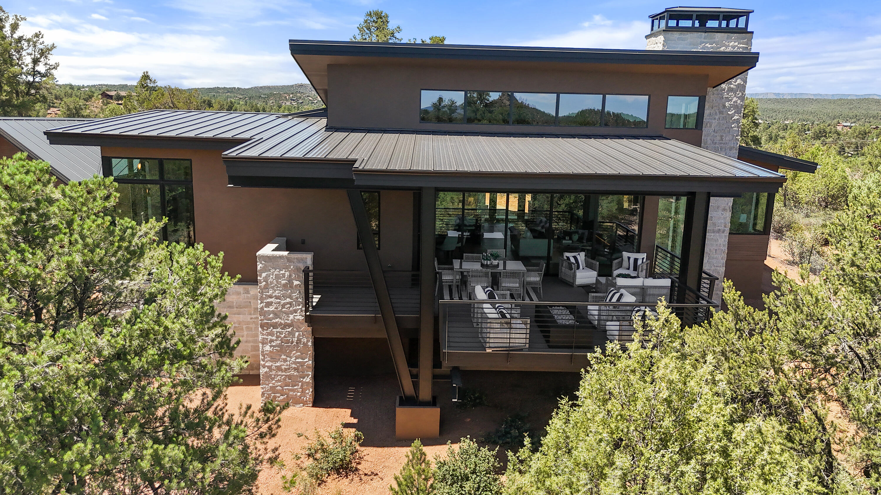 106 South Rim Club Drive Payson, AZ 85541 - Photo 8 of 45 a view of a patio with table and chairs potted plants