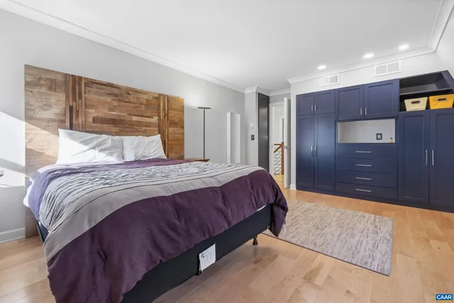 a bathroom with a granite countertop sink a toilet and a mirror