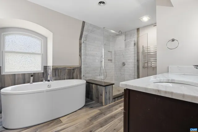 a view of entryway with stairs and wooden floor
