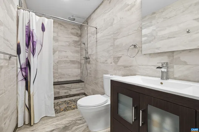 front view of a house with a tree