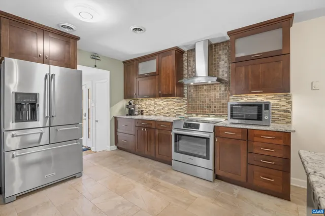 a spacious bedroom with a bed and a window