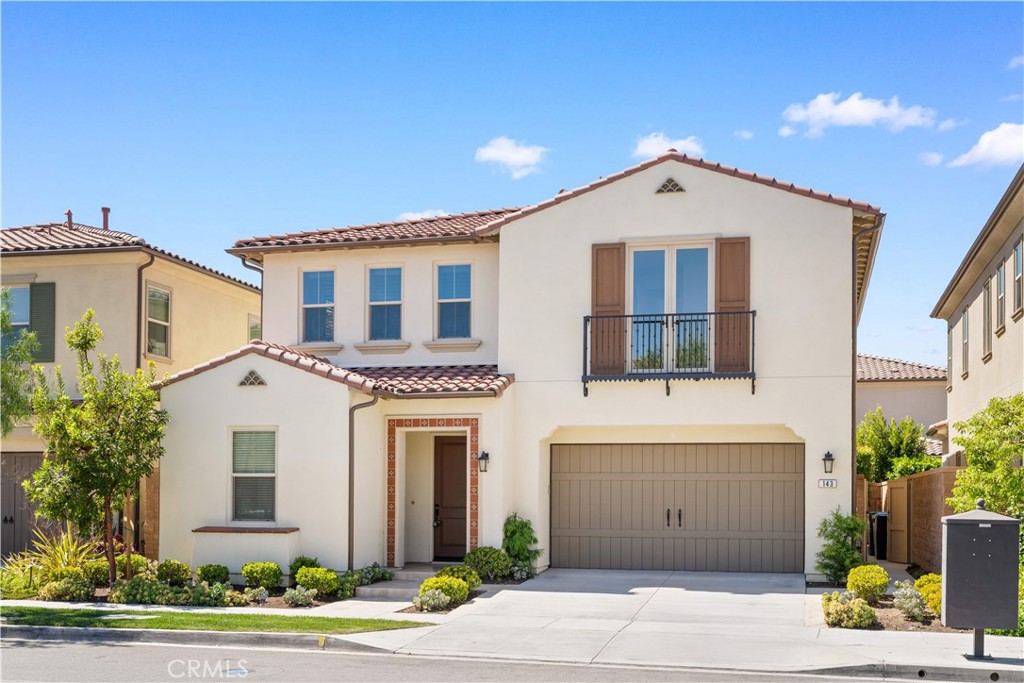 143 Ceremony Irvine, CA 92618 - Photo 1 of 74 a front view of a house with a garden