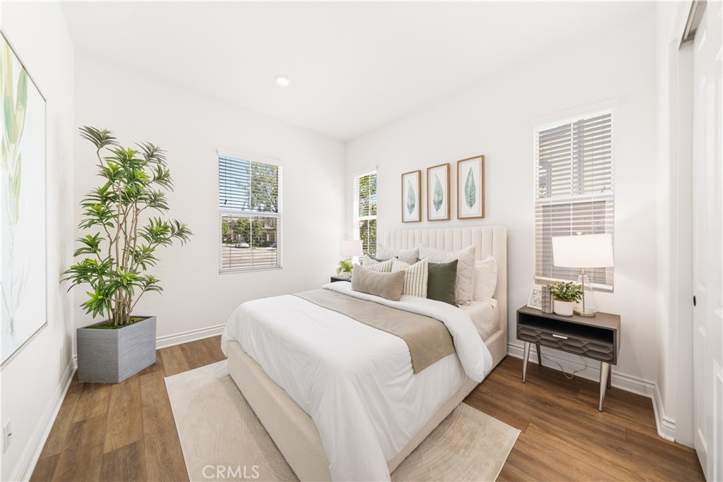 143 Ceremony Irvine, CA 92618 - Photo 31 of 74 a bedroom with a bed and a potted plant