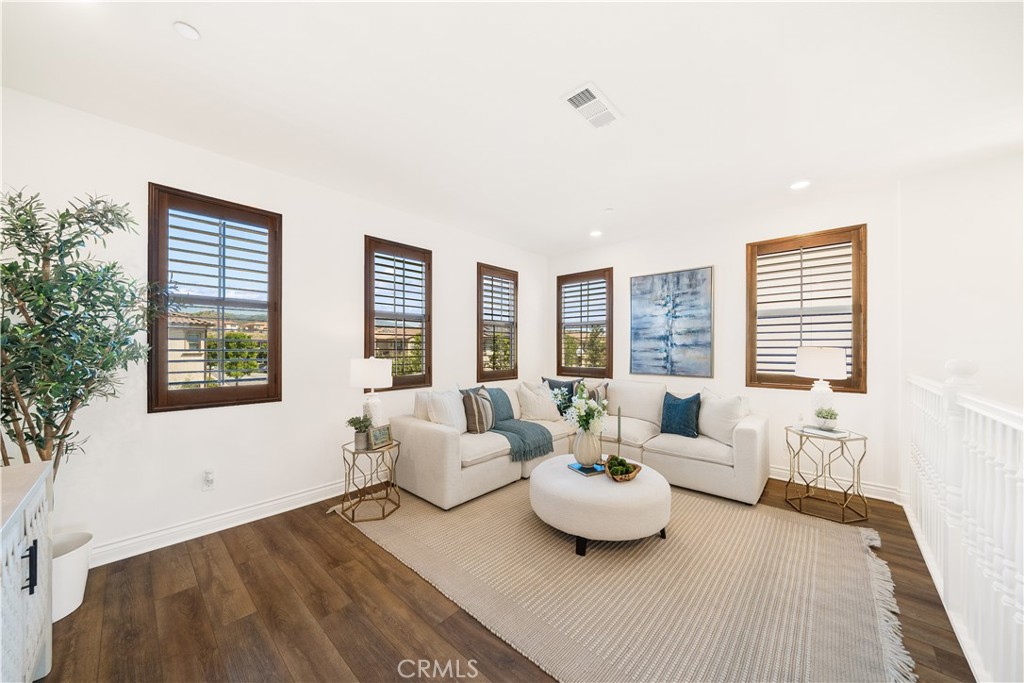 143 Ceremony Irvine, CA 92618 - Photo 34 of 74 a living room with furniture and a large window