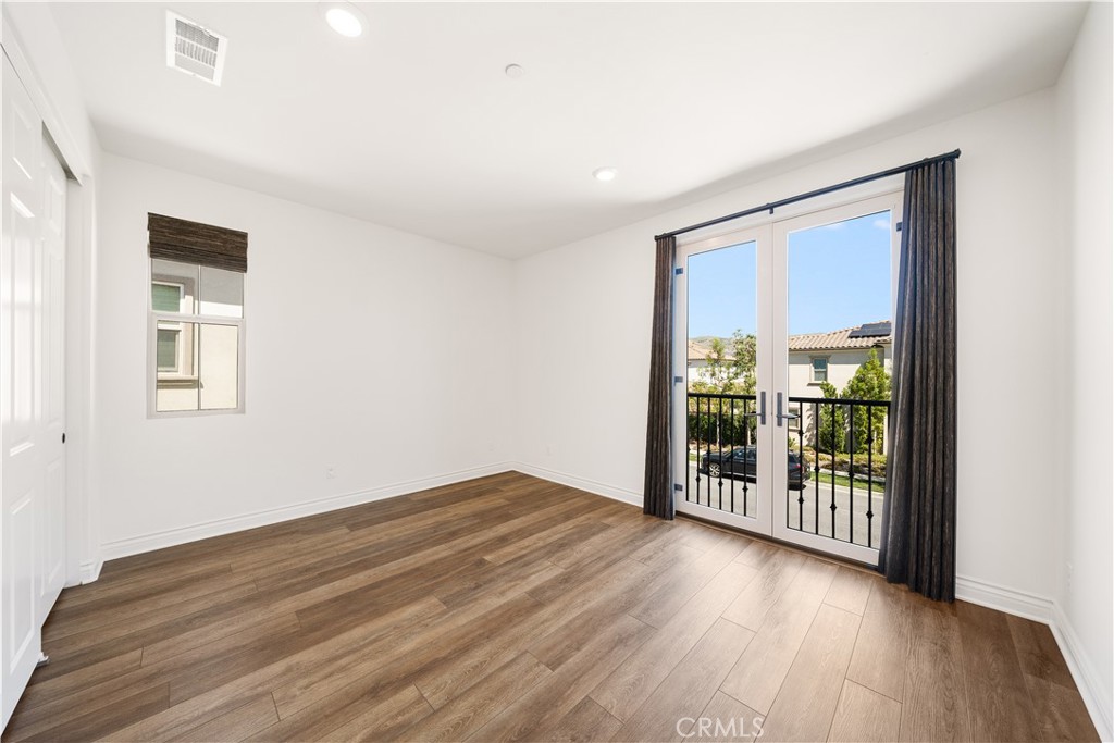 143 Ceremony Irvine, CA 92618 - Photo 43 of 74 wooden floor in an empty room with a window