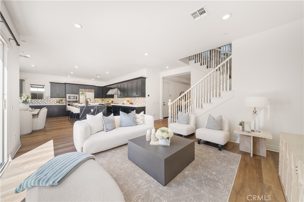 143 Ceremony Irvine, CA 92618 - Photo 7 of 74 a living room with furniture white walls and white walls