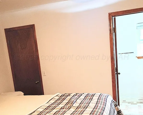 a view of bedroom and bathroom